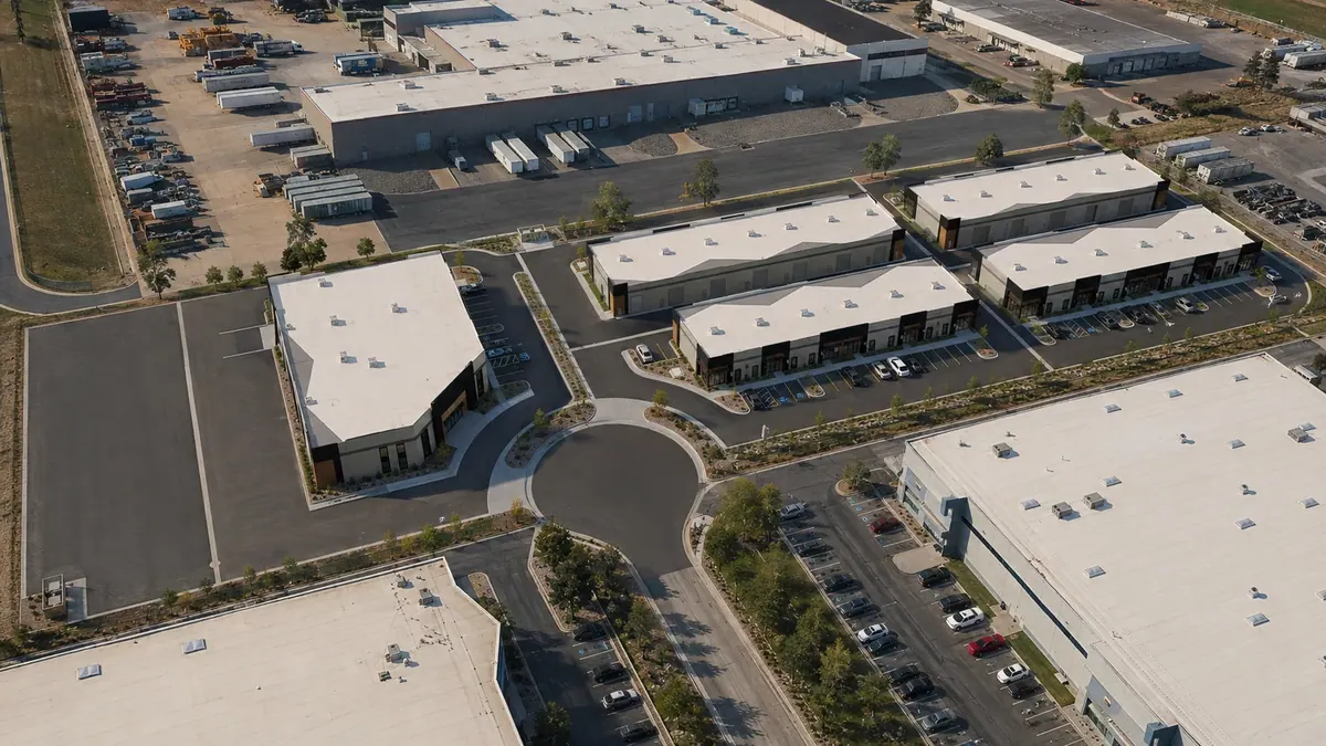 Aerial architectural rendering of the Base Camp multi-building commercial development and site circulation