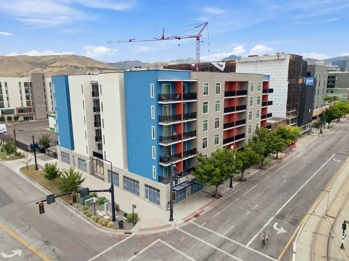 Elevated street view of Gateway Apartments with blue facade and construction nearby