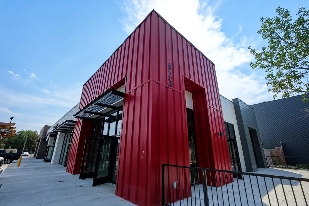 Red metal corner entry detail of the 8th and 9th multi-tenant retail building in Salt Lake City, Utah