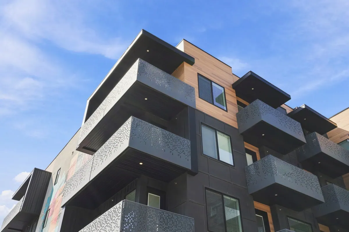 Upward architectural view of projecting balconies at Gallacher Apartments