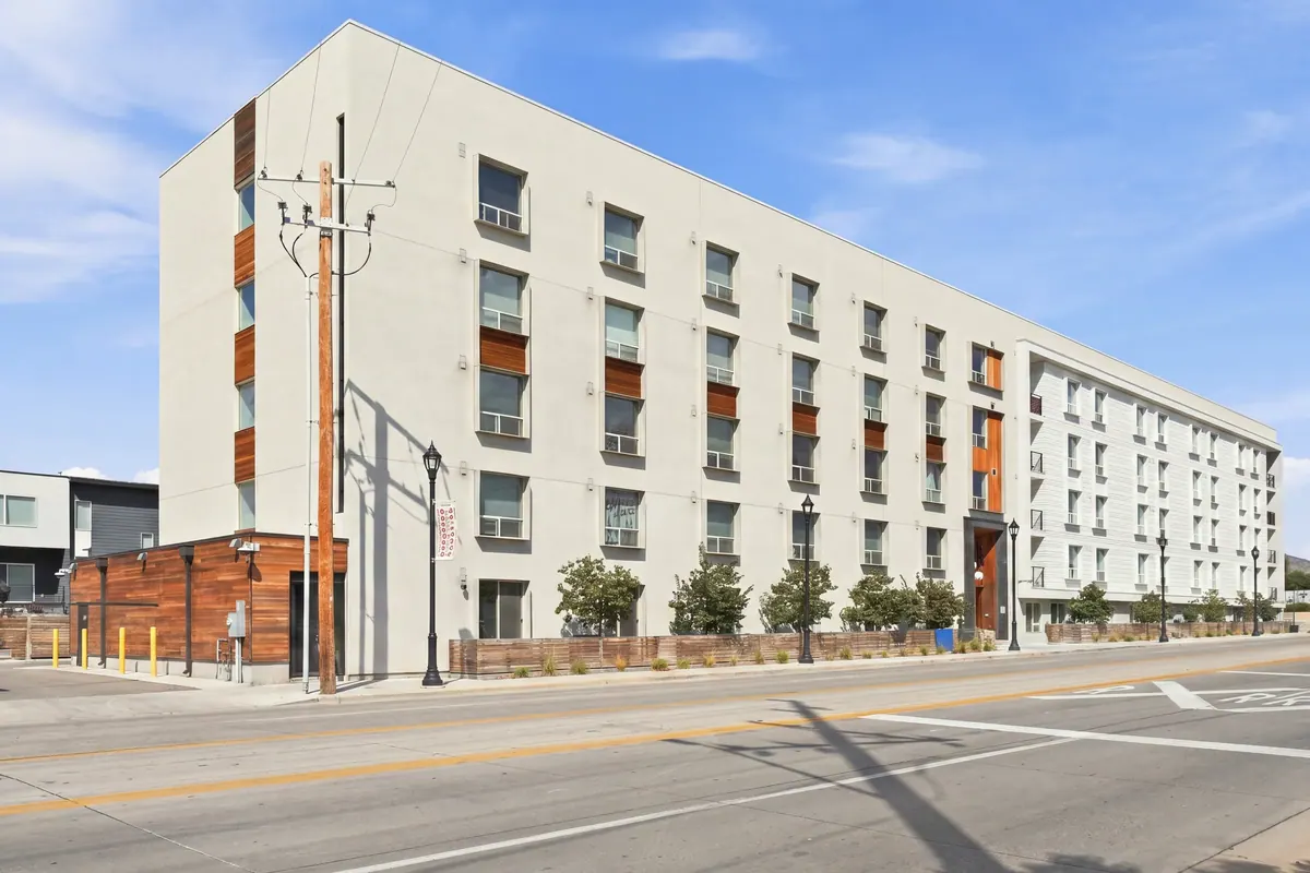 Colony B Apartments white exterior at a street corner