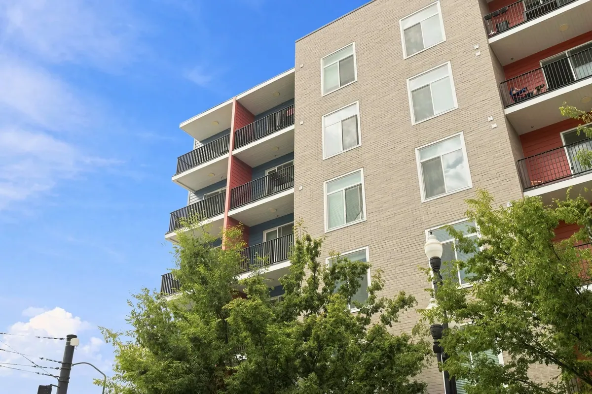 Gateway Apartments corner facade with balconies and masonry