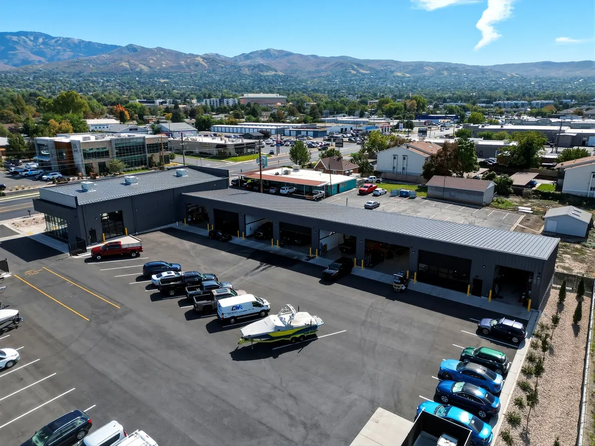Aerial view of the DC Customs and Boat Shack building, parking area, and rear service bays