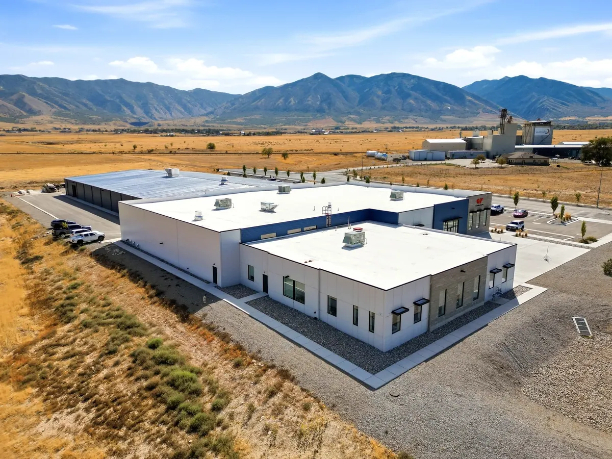 Elevated rear view of the Wheelhouse racing facility showing roofline and site context