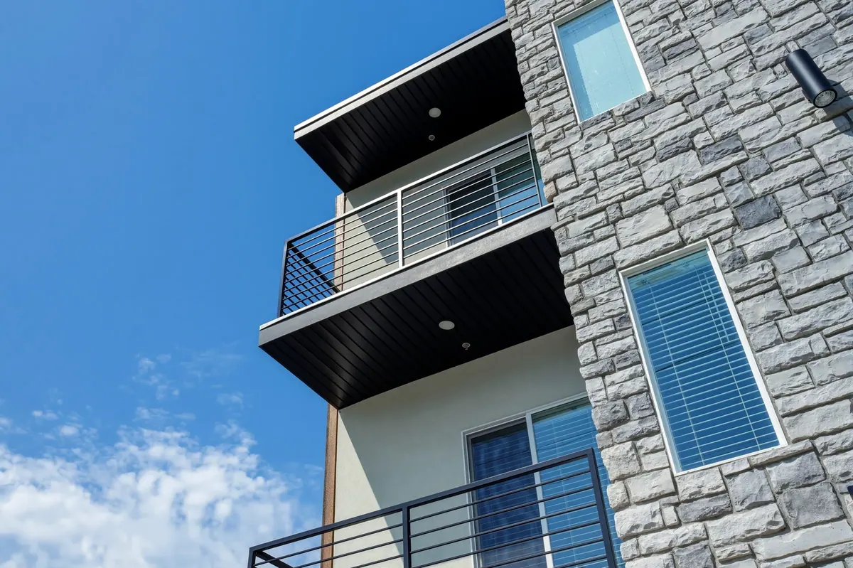 H Lofts — stone clad balcony detail