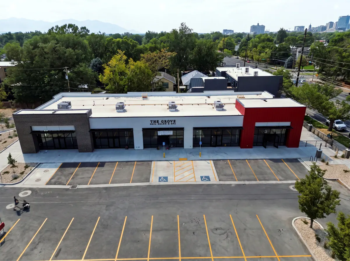 Aerial view of the 8th and 9th retail building, parking lot and surrounding neighborhood