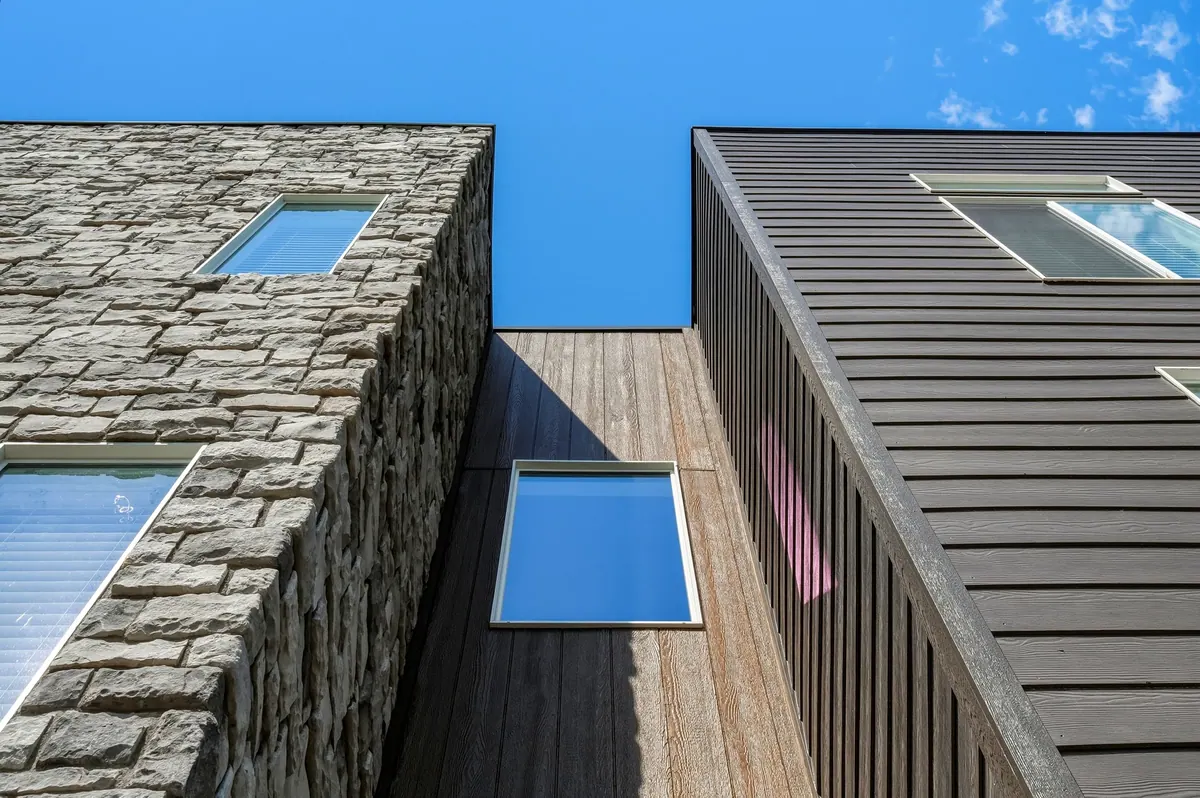 H Lofts — stone and wood facade detail