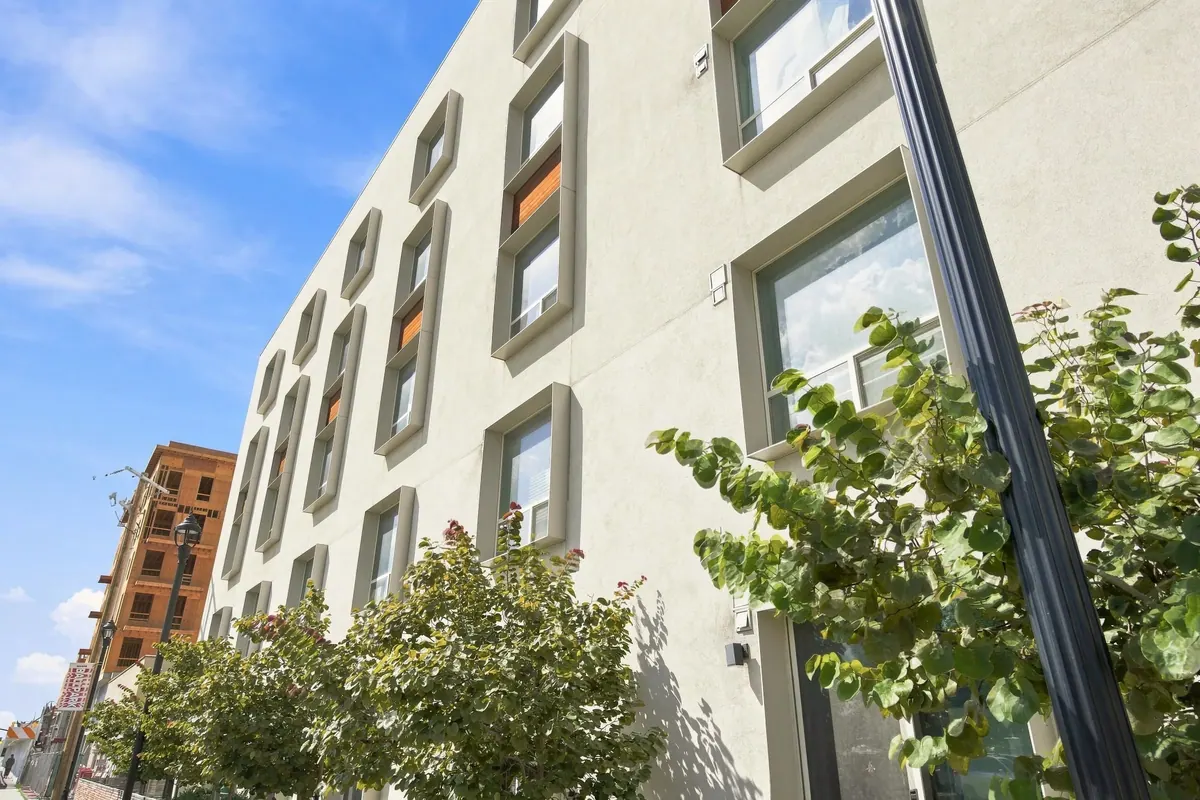 Colony B Apartments exterior facade with street landscaping