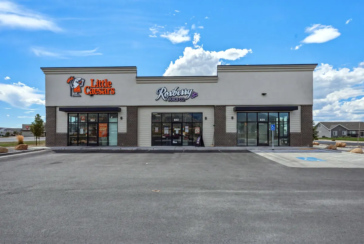 Front elevation of Salem Retail showing Little Caesars, a neighboring tenant and a vacant storefront