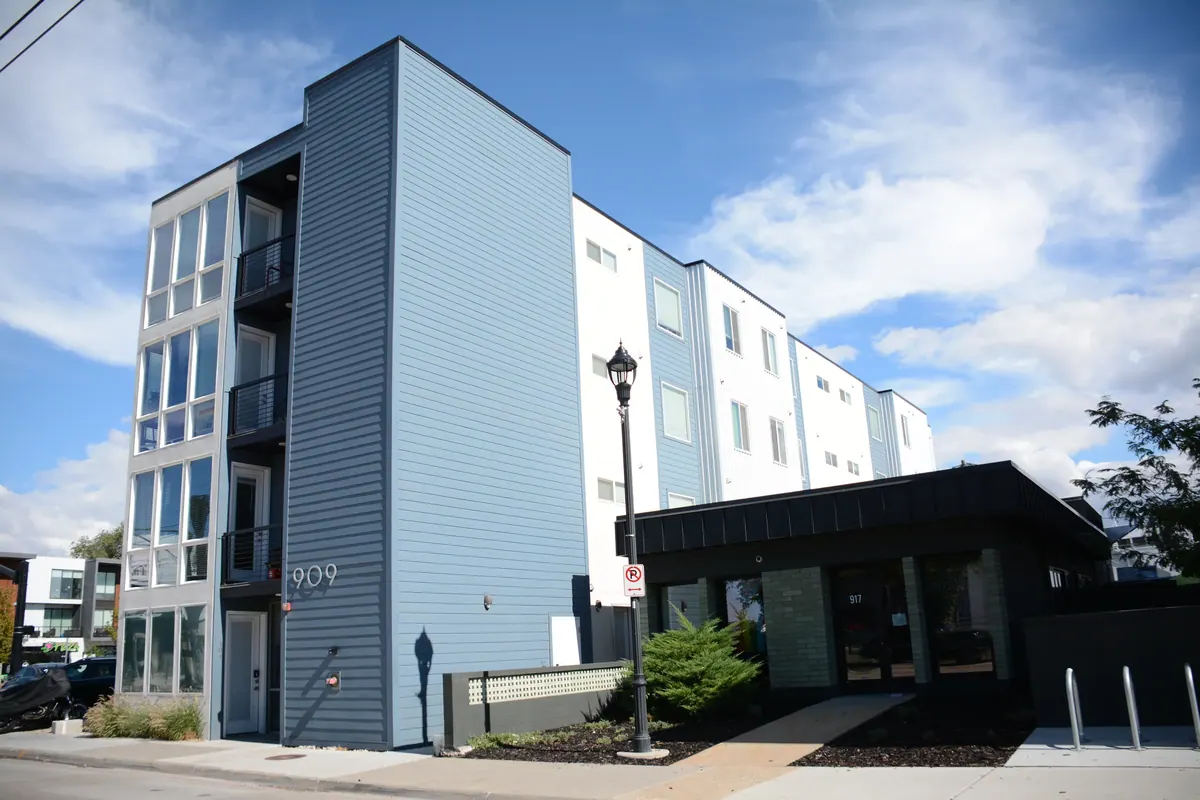 9th Station apartment exterior with corner windows and entrance