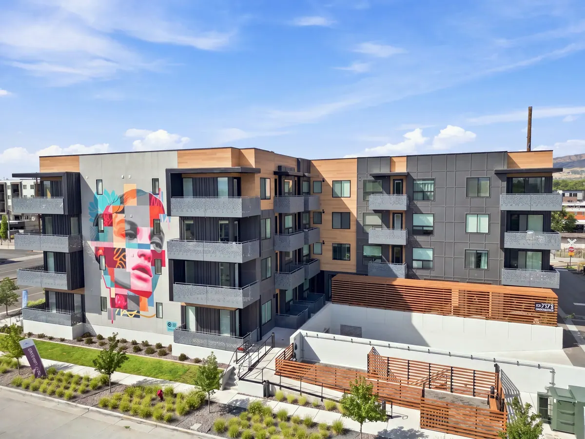 Gallacher Apartments exterior showing the colorful wall mural